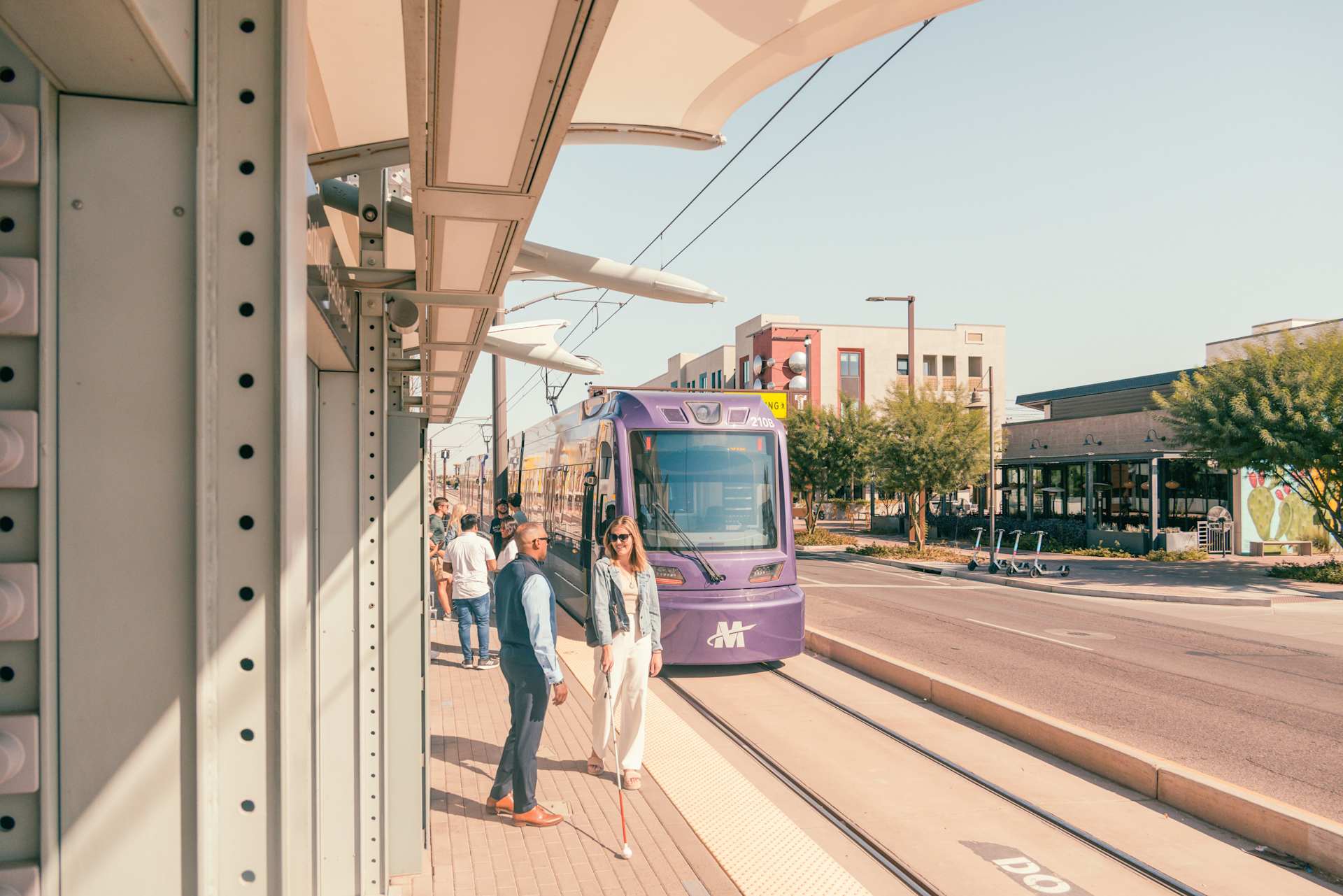 Riders at the Smith-Martin light-rail station